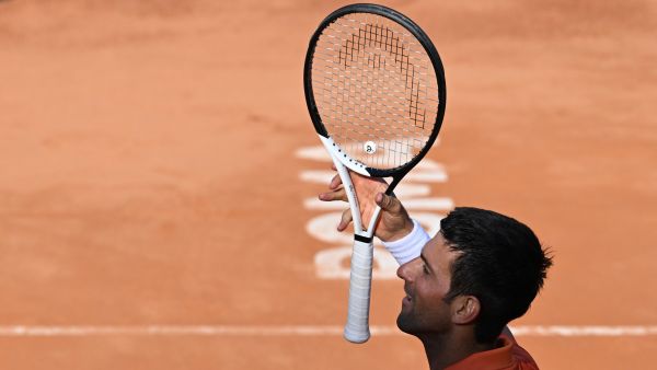 Serbia's Novak Djokovic celebrates after winning the final match of the Men's ATP Rome Open tennis tournament against Greece's Stefanos Tsitsipas on May 15, 2022 at Foro Italico in Rome. (Photo by Tiziana FABI / AFP)