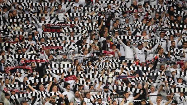 Frankfurt fans raise their scarves during the UEFA Europa League semi-final second leg football match Eintracht Frankfurt v West Ham United in Frankfurt, western Germany on May 5, 2022. (Photo by Christof STACHE / AFP)