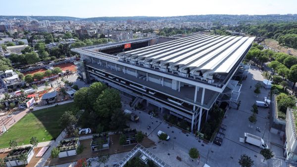 This aerial view shows the Philippe-Chatrier central tennis court with its sliding roof partially open at the Roland-Garros stadium in Paris on May 17, 2022. (Photo by Thomas SAMSON / AFP)