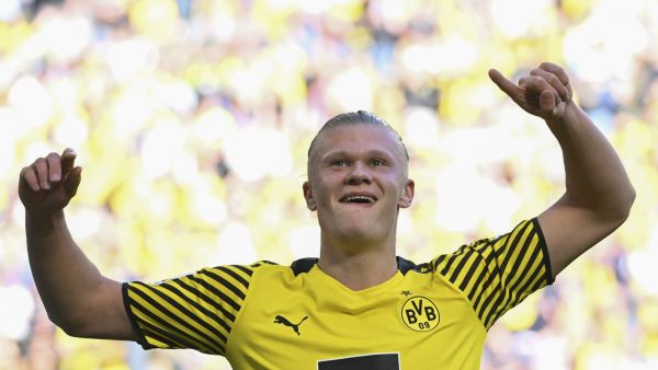 Dortmund's Norwegian forward Erling Braut Haaland celebrates scoring during the German first division Bundesliga football match Borussia Dortmund v VfL Wolfsburg in Dortmund, western Germany. Manchester City said Tuesday, May 10, they had reached an agreement in principle with Borussia Dortmund to sign striker Erling Haaland. (Photo by INA FASSBENDER / AFP)