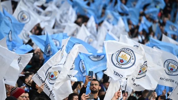 Mancherster City's supporters cheers during the UEFA Champions League semi-final first leg football match between Manchester City and Real Madrid, at the Etihad Stadium, in Manchester, on April 26, 2022. (Photo by Oli SCARFF / AFP)