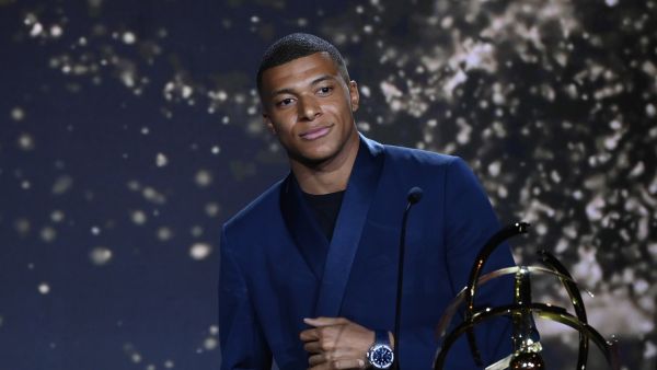 Paris Saint-Germain's French forward Kylian MBappe receives the Best Ligue 1 Player award during the TV show on May 15, 2022 in Paris, as part of the 30th edition of the UNFP (French National Professional Football players Union) trophy ceremony. (Photo by FRANCK FIFE / AFP)
