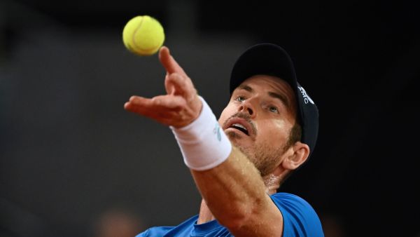 Great Britain's Andy Murray serves to Austria's Dominic Thiem during their 2022 ATP Tour Madrid Open tennis tournament singles match at the Caja Magica in Madrid on May 2, 2022. (Photo by GABRIEL BOUYS / AFP)