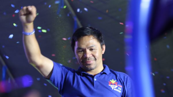 This photo taken on May 7, 2022 shows Philippine boxing icon and presidential candidate Manny Pacquiao raising a clinched fist during a campaign rally in General Santos City, on the southern island of Mindanao. (Photo by AFP)
