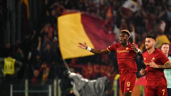 Roma's British forward Tammy Abraham (L) celebrates after opening the scoring during the UEFA Conference League semi-final second leg football match between AS Roma and Leicester City at The Olympic Stadium in Rome, on May 5, 2022. (Photo by Isabella BONOTTO / AFP)