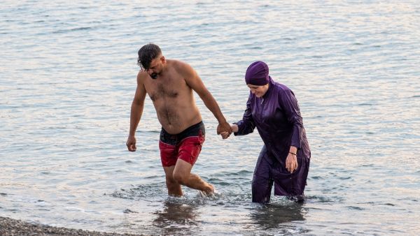 lawmakers in Grenoble, France, voted to allow Muslim women to wear burqini swimsuits at state-run swimming pools