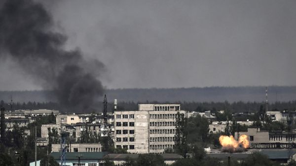 A photograph shows an explosion in the city of Severodonetsk during heavy fightings between Ukrainian and Russian troops at eastern Ukrainian region of Donbas on May 30, 2022, on the 96th day of the Russian invasion of Ukraine. (Photo by ARIS MESSINIS / AFP) Severodonetsk