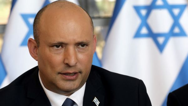 In this file photo taken on May 29, 2022, Israeli Prime Minister Naftali Bennett speaks during the weekly cabinet meeting in Jerusalem.(Photo by GIL COHEN-MAGEN / POOL / AFP) Israeli government could collapse over failure to pass bill upholding settler law