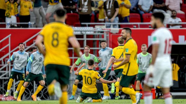 Australia's midfielder Ajdin Hrustic (C) celebrates after scoring his team's second goal during the FIFA World Cup 2022 play-off qualifier football match between UAE and Australia at Ahmad bin Ali stadium in Qatar's Ar-Rayyan city on June 7, 2022. (Photo by Mustafa ABUMUNES / AFP)