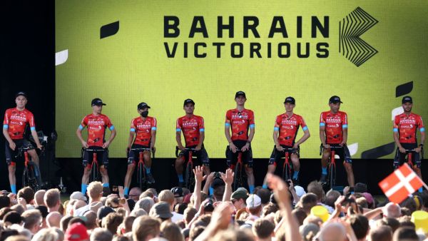 Bahrain Victorious team riders attend the cycling teams' presentation two days ahead of the first stage of the 109th edition of the Tour de France cycling race, in Copenhagen, in Denmark, on June 29, 2022. (Photo by Thomas SAMSON / AFP)