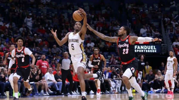 Herbert Jones #5 of the New Orleans Pelicans steals the ball from Ben McLemore #23 of the Portland Trail Blazers during the first half at the Smoothie King Center on April 07, 2022 in New Orleans, Louisiana.  (Photo by Jonathan Bachman / GETTY IMAGES NORTH AMERICA / Getty Images via AFP)