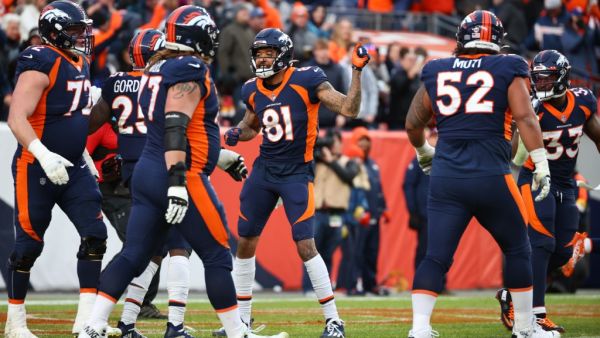 Melvin Gordon #25 of the Denver Broncos celebrates with Tim Patrick #81 following his touchdown run during the third quarter against the Kansas City Chiefs of the Denver Broncos at Empower Field At Mile High on January 08, 2022 in Denver, Colorado. Jamie Schwaberow/Getty Images/AFP (Photo by Jamie Schwaberow / GETTY IMAGES NORTH AMERICA / Getty Images via AFP)