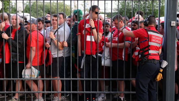 In this file photo taken on May 28, 2022 Liverpool fans stand outside unable to get in in time leading to the match being delayed prior to the UEFA Champions League final football match between Liverpool and Real Madrid at the Stade de France in Saint-Denis, north of Paris.  (Photo by THOMAS COEX / AFP)