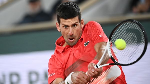 Serbia's Novak Djokovic returns the ball to Spain's Rafael Nadal during their men's quarter-final singles match on day ten of the Roland-Garros Open tennis tournament at the Court Philippe-Chatrier in Paris early on June 1, 2022. (Photo by Anne-Christine POUJOULAT / AFP)