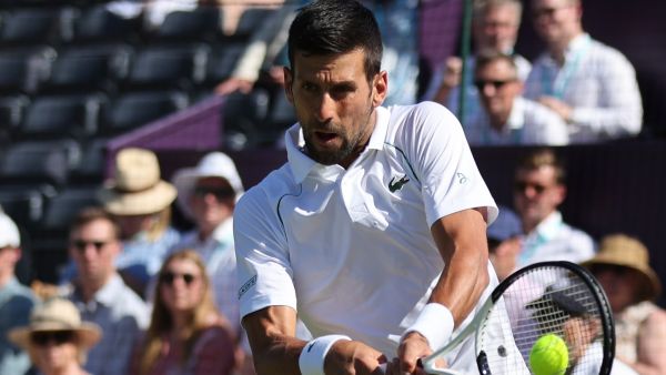 Serbia's Novak Djokovic returns the ball to Canada's Felix Auger-Aliassime during their men's exhibition singles match at The Giorgio Armani Tennis Classic tournament at the Hurlingham Club, in London, on June 22, 2022. (Photo by Adrian DENNIS / AFP)