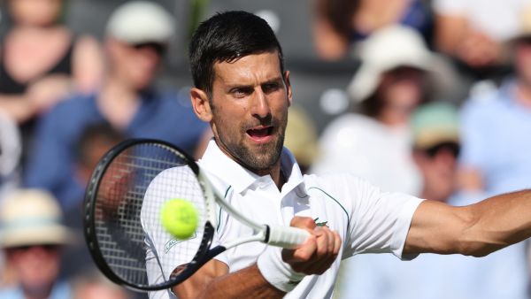Serbia's Novak Djokovic returns the ball to Canada's Felix Auger-Aliassime during their men's exhibition singles match at The Giorgio Armani Tennis Classic tournament at the Hurlingham Club, in London, on June 22, 2022. (Photo by Adrian DENNIS / AFP)
