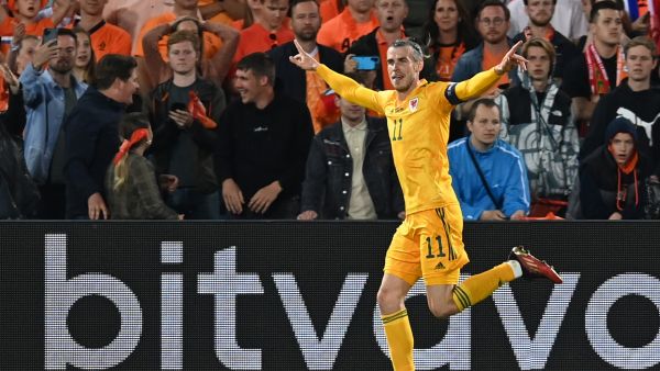 Wales' striker Gareth Bale celebrates after scoring his team's second goal during the UEFA Nations League - League A Group 4 football match between Netherlands and Wales at the Feyenoord "De Kuip" stadium in Rotterdam, on June 14, 2022. (Photo by JOHN THYS / AFP)