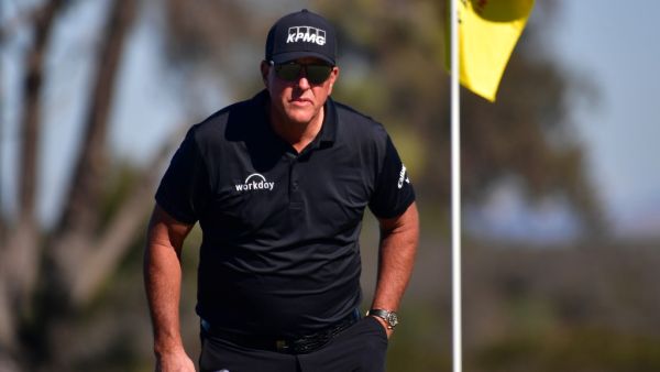 Phil Mickelson lines up his putt on the 10th hole green during the second round of The Farmers Insurance Open on the North Course at Torrey Pines Golf Course on January 27, 2022 in La Jolla, California. Donald Miralle/Getty Images/AFP (Photo by DONALD MIRALLE / GETTY IMAGES NORTH AMERICA / Getty Images via AFP)