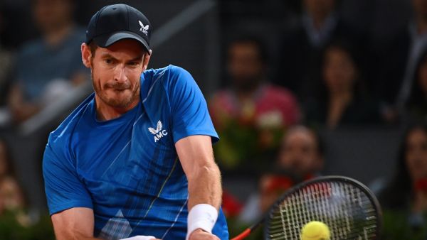 Great Britain's Andy Murray returns the ball to Austria's Dominic Thiem during their 2022 ATP Tour Madrid Open tennis tournament singles match at the Caja Magica in Madrid on May 2, 2022. (Photo by GABRIEL BOUYS / AFP)