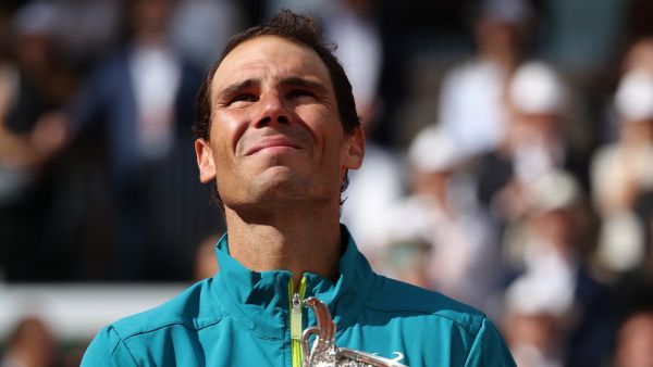 Spain's Rafael Nadal poses with The Musketeers' Cup as he celebrates after victory over Norway's Casper Ruud during their men's singles final match on day fifteen of the Roland-Garros Open tennis tournament at the Court Philippe-Chatrier in Paris on June 5, 2022. (Photo by Thomas SAMSON / AFP)