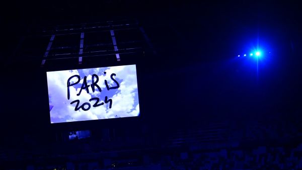 A video announcing the Paris 2024 Olympics Game is seen during the closing ceremony of the Tokyo 2020 Olympic Games, at the Olympic Stadium, in Tokyo, on August 8, 2021. (Photo by Pedro PARDO / AFP)