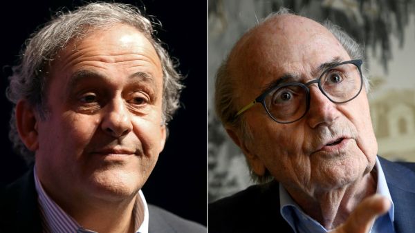 Michel Platini and Sepp Blatter (Photo by VALERY HACHE and Fabrice COFFRINI / AFP)