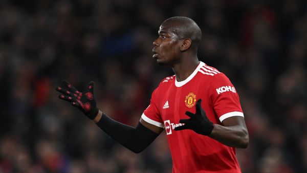 Manchester United's French midfielder Paul Pogba gestures during the UEFA Champions League round of 16 second leg football match between Manchester United and Atletico Madrid at Old Trafford stadium in Manchester, north west England on March 15, 2022. (Photo by Paul ELLIS / AFP)