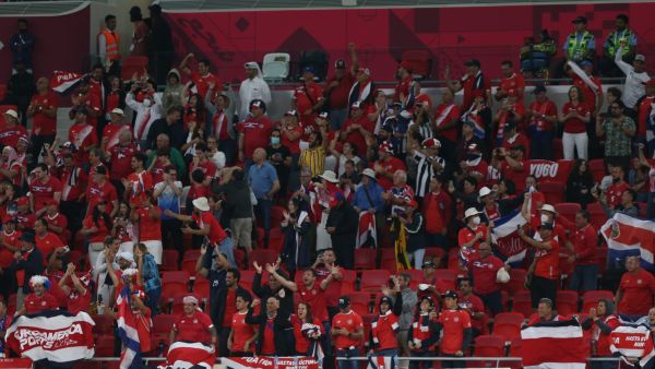 Costa Rica supporters celebrate their opening goal during the FIFA World Cup 2022 inter-confederation play-offs match between Costa Rica and New Zealand on June 14, 2022, at the Ahmed bin Ali Stadium in the Qatari city of Ar-Rayyan. (Photo by Mustafa ABUMUNES / AFP)