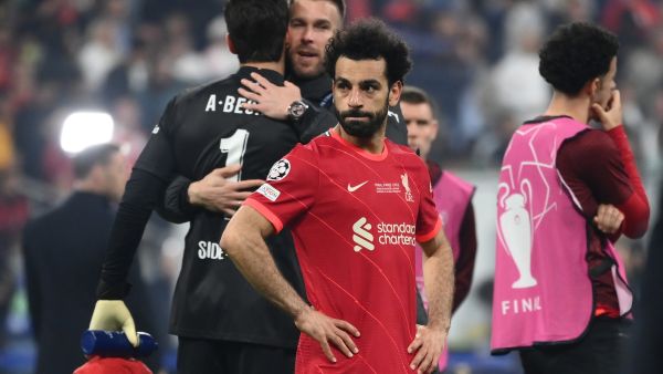 Liverpool's Egyptian midfielder Mohamed Salah (C) reacts after Real Madrid's victory in the UEFA Champions League final football match between Liverpool and Real Madrid at the Stade de France in Saint-Denis, north of Paris, on May 28, 2022. (Photo by FRANCK FIFE / AFP)