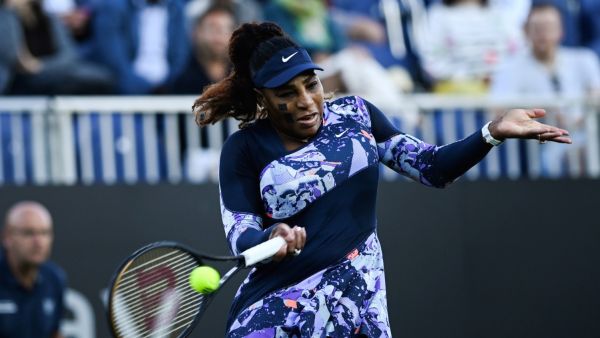 Serena Williams of the US, playing with Tunisia's Ons Jabeur, returns the ball to Japan's Shuko Aoyama and Taiwan's Chan Hao-ching during their women's doubles quarter final tennis match on day four of the Eastbourne International tennis tournament in Eastbourne, southern England on June 22, 2022. (Photo by Glyn KIRK / AFP)