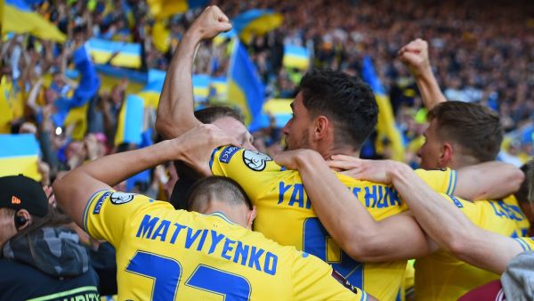 Ukraine's striker Roman Yaremchuk celebrates scoring the team's second goal during the FIFA World Cup 2022 play-off semi-final qualifier football match between Scotland and Ukraine at Hampden Park in Glasgow, Scotland on June 1, 2022. (Photo by ANDY BUCHANAN / AFP)