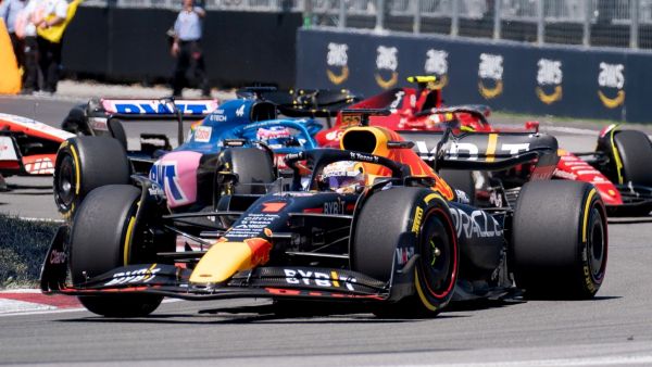 Red Bull Racing's Dutch driver Max Verstappen leads the pack as he races during the Canada Formula 1 Grand Prix on June 19, 2022, at Circuit Gilles-Villeneuve in Montreal. (Photo by Geoff Robins / AFP)