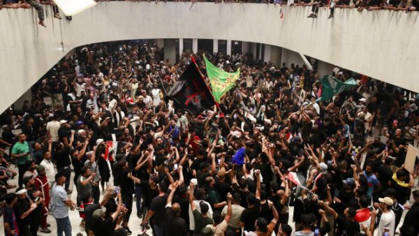 Supporters of cleric Moqtada Sadr cheer after entering Iraq's parliament