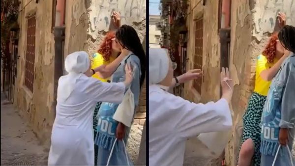 Italian nun in white seen pulling apart two girls who were kissing in the street. (Twitter/ Video screenshot) Italian nun