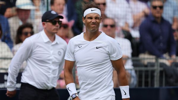Spain's Rafael Nadal grimaces for hitting the ball out as he plays against Canada's Felix Auger-Aliassime during their men's exhibition singles match at The Giorgio Armani Tennis Classic tournament at the Hurlingham Club in London on June 24, 2022. (Photo by Adrian DENNIS / AFP)