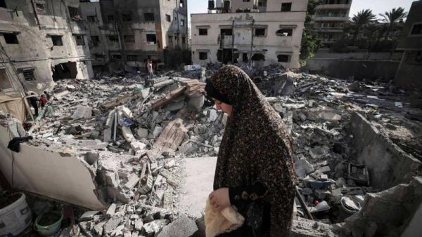 Woman amidst the rubble in Gaza 