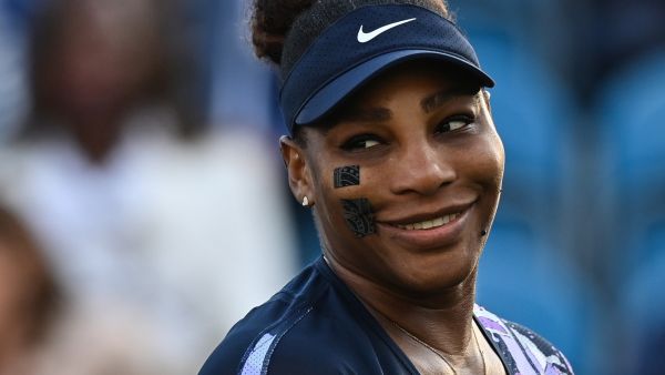 US player Serena Williams reacts as she plays with Tunisia's Ons Jabeur against Spain's Sara Sorribes Tormo and Czech Republic's Marie Bouzkova during their round of 8 women's doubles tennis match , on day three, of the Eastbourne International tennis tournament in Eastbourne, southern England on June 21, 2022. (Photo by Glyn KIRK / AFP)