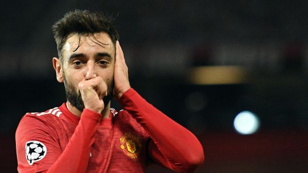 Manchester United's Portuguese midfielder Bruno Fernandes celebrates scoring the second goal during the UEFA Champions league group H football match between Manchester United and Istanbul Basaksehir at Old Trafford stadium in Manchester, north west England, on November 24, 2020. / AFP / Oli SCARFF
