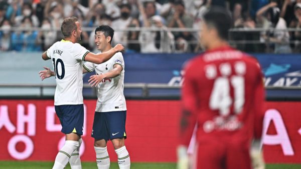 Tottenham Hotspur's Harry Kane (L) celebrates his goal with teammate Son Heung-min (C) against Team K League during the exhibition football match between Tottenham Hotspur and Team K League at Seoul World Cup Stadium in Seoul on July 13, 2022. (Photo by Jung Yeon-je / AFP)