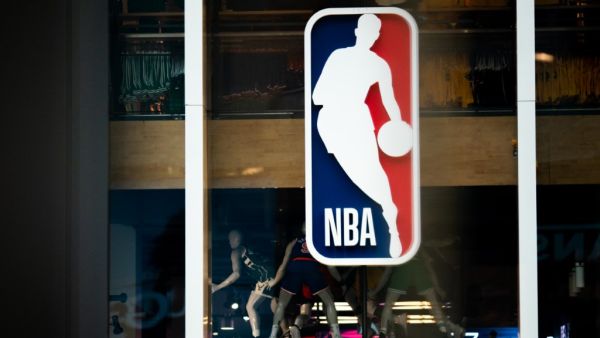 An NBA logo is shown at the 5th Avenue NBA store on March 12, 2020 in New York City. Jeenah Moon/Getty Images/AFP / Getty Images via AFP / GETTY IMAGES NORTH AMERICA / Jeenah Moon