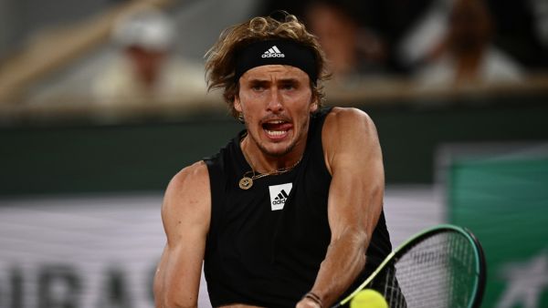 Germany's Alexander Zverev plays a backhand return to Spain's Rafael Nadal during their men's semi-final singles match on day thirteen of the Roland-Garros Open tennis tournament at the Court Philippe-Chatrier in Paris on June 3, 2022. (Photo by Christophe ARCHAMBAULT / AFP)