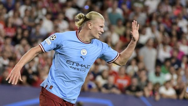 Manchester City's Norwegian striker Erling Haaland celebrates after scoring his team's third goal during the UEFA Champions League Group G first-leg football match between Sevilla FC and Manchester City, at the Ramon Sanchez Pizjuan stadium in Seville on September 6, 2022. (Photo by CRISTINA QUICLER / AFP)