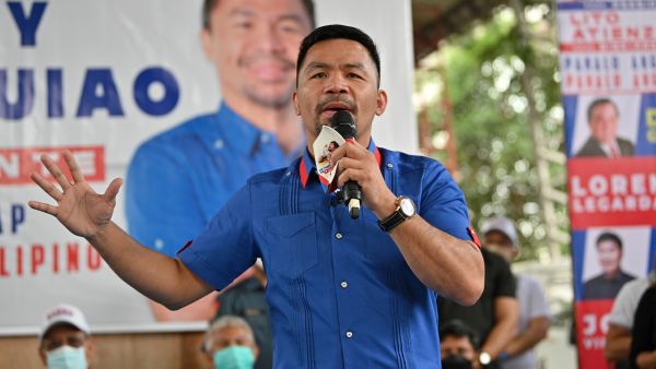 Manny Pacquiao, Philippine boxing legend and presidential candidate, speaks during a campaign stop ahead of the May 9 presidential election, in suburban Manila on February 16, 2022. (Photo by Ted ALJIBE / AFP)