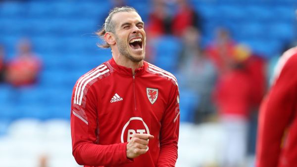 Wales' midfielder Gareth Bale smiles as he warms up ahead of the UEFA Nations League, league A group 4 football match between Wales and Netherlands at Cardiff City stadium in Cardiff, south Wales on June 8, 2022. (Photo by Geoff Caddick / AFP)