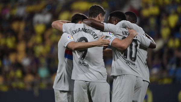 Barcelona's Spanish midfielder Ansu Fati (2nd-R) celebrates with teammates after scoring his team's third goal during the Spanish league football match between Cadiz CF and FC Barcelona at the Nuevo Mirandilla stadium in Cadiz, on September 10, 2022. (Photo by CRISTINA QUICLER / AFP)