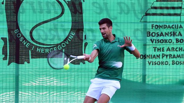 Serbian tennis player Novak Djokovic returns the ball during an exhibition match, organised to mark the opening of a tennis court at the "Archaeological park of the Bosnian pyramid" near Visoko, north of Sarajevo, on July 13, 2022. (Photo by ELVIS BARUKCIC / AFP)
