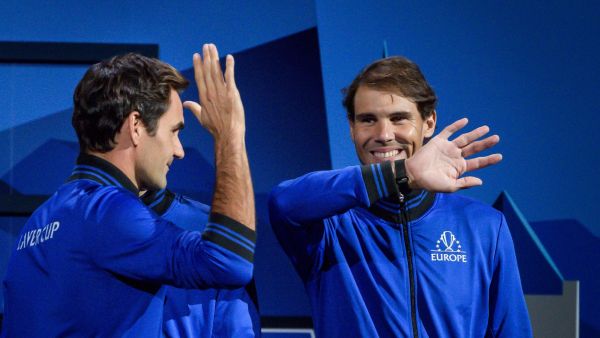 Team Europe's players Roger Federer (L) and Rafael Nadal greets each other prior to the start of the 2019 Laver Cup tennis tournament in Geneva, on September 20, 2019. / AFP / Fabrice COFFRINI