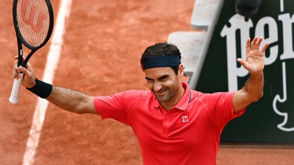 Switzerland's Roger Federer celebrates after winning against Croatia's Marin Cilic during their men's singles second round tennis match on Day 5 of The Roland Garros 2021 French Open tennis tournament in Paris on June 3, 2021. (Photo by Anne-Christine POUJOULAT / AFP)