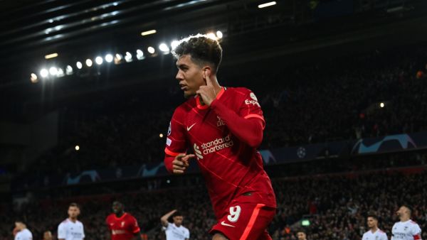  Liverpool's Brazilian midfielder Roberto Firmino celebrates after scoring his team third goal during the UEFA Champions League quarter final second leg football match between Liverpool and Benfica at the Anfield stadium, in Liverpool, on April 13, 2022. (Photo by Paul ELLIS / AFP)