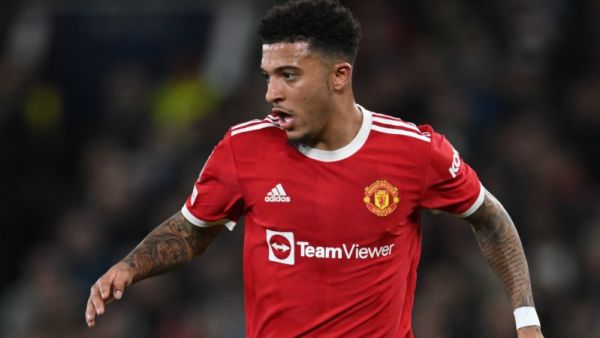 Manchester United's English striker Jadon Sancho runs with the ball during the UEFA Champions League round of 16 second leg football match between Manchester United and Atletico Madrid at Old Trafford stadium in Manchester, north west England on March 15, 2022. (Photo by Paul ELLIS / AFP)